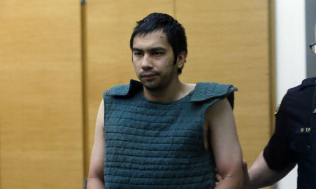Shooting suspect Aaron Ybarra, left, is led in chains to a court hearing at a King County Jail cour...