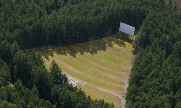 An aerial view of the Wheel-In Motor Movie Drive-In in Port Townsend, surrounded by forest. (Photo ...