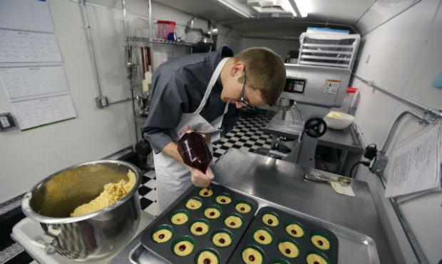 In this June 19, 2014 photo, chef Alex Tretter prepares cannabis-infused peanut butter and jelly cu...