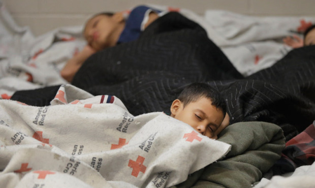 This file photo shows children detainees sleeping in a holding cell at a U.S. Customs and Border Pr...