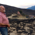 Dale Burnison, 75, cannot believe that his homestead is still standing after the Carlton Complex fire passed through his rural Pateros, Washington, neighborhood. His is the only home in the area that was spared. 