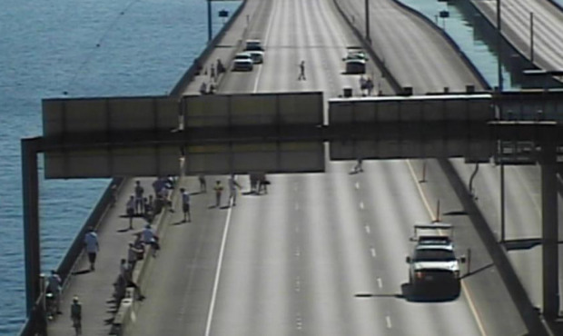 Blue Angels fans stand on the I-90 bridge Thursday morning to watch practice. (Photo: WSDOT)...