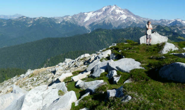 U.S. Geological Survey scientist Rick LaHusen surveys a potential site for a seismic station to mon...