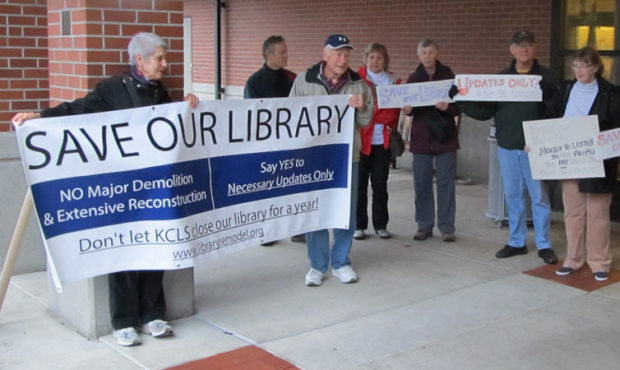About 15 people showed up for a protest at the Mercer Island Library on Wednesday. (Photo: The Conc...