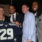Earl Thomas and Richard Sherman pose with some auction winners at the first annual Guardian Angel Foundation Seahawks and Steaks fundraiser Monday night in Bellevue.
