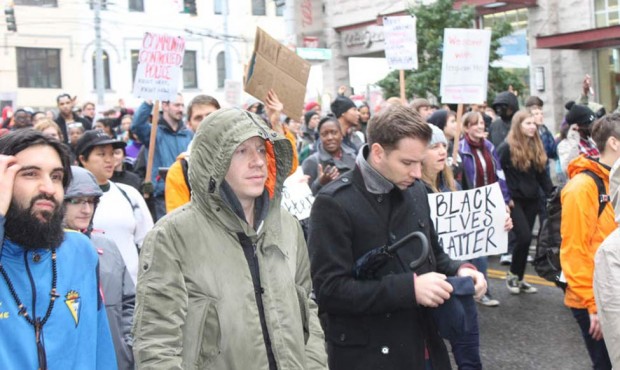 Seattle rapper Macklemore is shown taking part in a protest in downtown Seattle on Tuesday, Nov. 25...