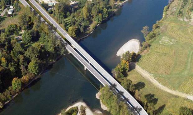 A graphic representation shows an aerial view of the new Snohomish River Bridge. The new bridge wil...