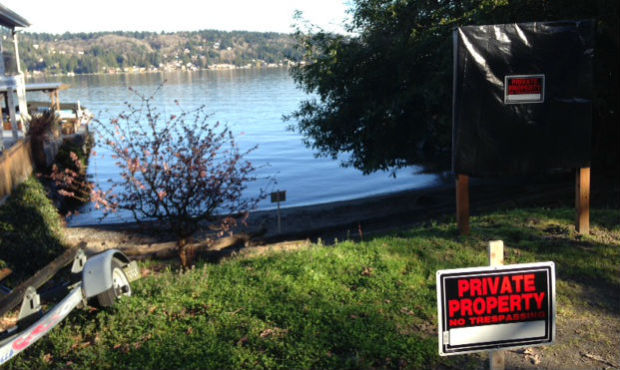 Neighbors vow to keep up their fight for access to a popular Lake Washington beach despite nearby p...