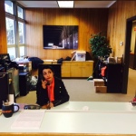 'Twin Peaks' fan Christin Carlano sits in the desk where the character Lucy sat, inside the building used to film the Twin Peaks sheriff's station. It is now Dirtfish Rally Car School.
