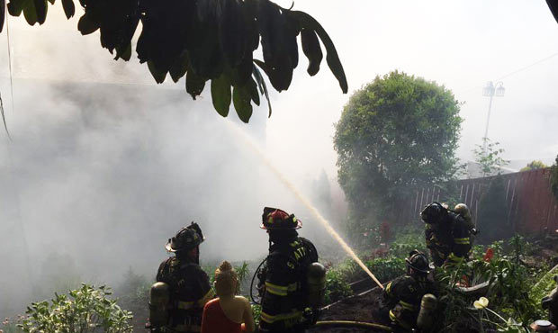 Two single-family homes were heavily damaged or destroyed in a fire in West Seattle Thursday aftern...