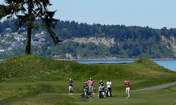 A golfer tees off the 16th hole April 27 at Chambers Bay, the course that will host the 2015 U.S. O...
