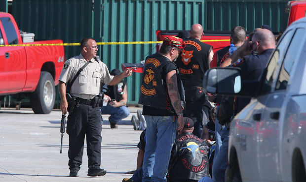 Authorities investigate a shooting in the parking lot of the Twin Peaks restaurant May 17, in Waco,...
