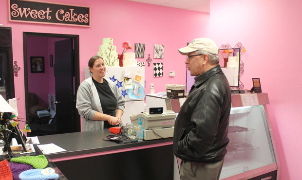 This photo shows Melissa Klein, co-owner of Sweet Cakes by Melissa in Gresham, Ore., telling a cust...