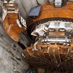 March 30, 2015 Bertha's 2,000-ton front end is lifted to the surface for repairs. The lift began around noon and the piece is visible at the surface a few hours later. The lift didn't finish until the following afternoon.