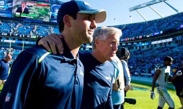 Seahawks head coach Pete Carroll and his son, Nate, walk off the field together. (Photo: Rod Mar)...