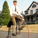 Gabriel Chrisman rides one of his vintage Victorian bicycles. He works at a bike shop. 