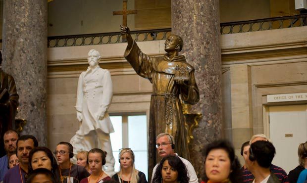 The statue of missionary Junipero Serra, center, is seen in Statuary Hall, also known as the Old Ha...