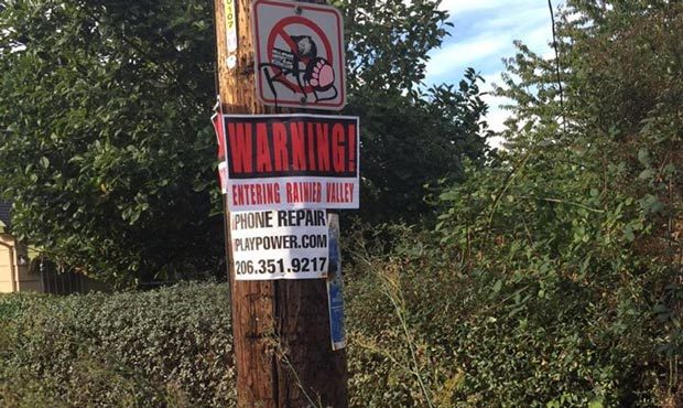 Signs stating “Warning: Entering Rainier Valley” were posted throughout the Seattle nei...