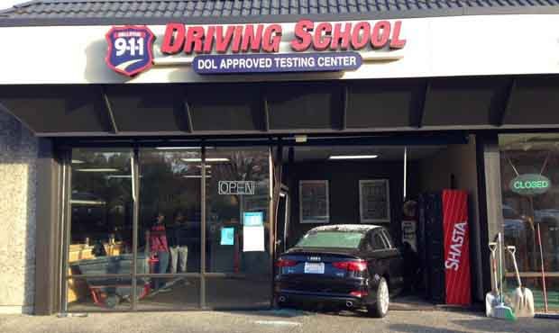 A student driver smashed through the front of a driver’s school door in Bellevue. (Bellevue P...