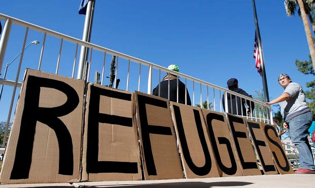 A sign welcoming Syrian refugees is placed at the entrance to the office of the Arizona governor du...