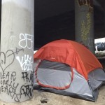 A tent pitched underneath I-5 in The Jungle. 