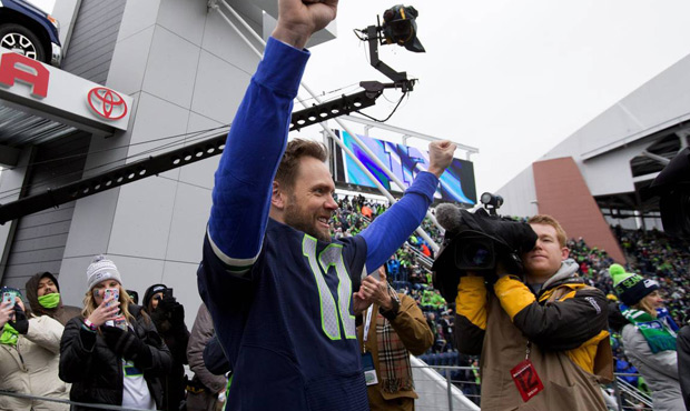 Actor/comedian Joel McHale raised the 12th Man flag at CenturyLink Field on Dec. 27. (AP)...