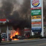 A truck caught fire while in a bay at a Seattle gas station. 