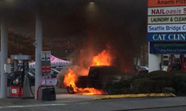 Nearby businesses were evacuated as Seattle fire crews responded to a truck fire in a bay at a gas ...