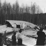 Crowds view the crumpled remains of the Boeing Stratoliner, which crashed near Alder, Washington, 30 miles southeast of Tacoma, on March 18, 1939.