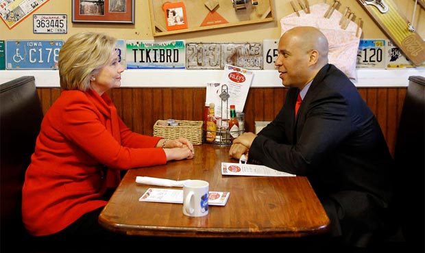 Democratic presidential candidate Hillary Clinton, left, chats with Sen. Cory Booker, D-N.J., at Ri...