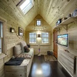 The high ceilings and multiple windows create lots of light on the inside that makes this tiny house look and feel bigger. (Photo: Chris Tack)