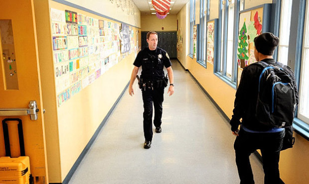 Officer Rick Moore, of the Oakland School District Police, patrols Oakland Technical High School in...