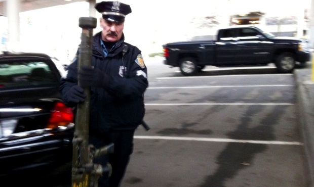 A member of the Seattle Police Department holds what was described as a “military rocket laun...