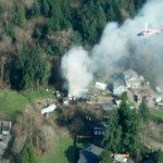 @KimiKline tweets: "Large smoke plume west of 405 near ne160th due to a house fire. Special cameo from @KIRO7Seattle Chopper 7"