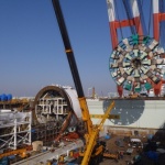 Crews in Japan remove the 57.5-foot-diameter cutterhead from Bertha, the machine that will dig the SR 99 tunnel in Seattle.