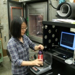 Undergraduate student Stella Choi works on the experiments.