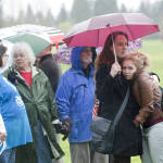 
 Lori Ray, right, of Ridgefield, Wash., snuggles up to her mother, Lily, as they wait in line, in the rain, to attend a rally for Democratic presidential candidate Bernie Sanders, I-Vt., at Hudson's Bay High School in Vancouver, Wash., Sunday, March 21, 2016. (Natalie Behring/The Columbian via AP)
            