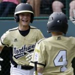 Sammamish, Wash.'s Jack Carper, left, celebrates with Jack Titus (4) after hitting a solo home run against Corpus Christi, Texas, during the second inning of a baseball game in U.S. pool play at the Little League World Series tournament in South Williamsport, Pa., Thursday, Aug. 15, 2013. (AP Photo/Gene J. Puskar)