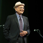 Norman Lear, television writer and producer, speaks at the opening of Starbucks Coffee Company's annual shareholders meeting, Wednesday, March 19, 2014, in Seattle. (AP Photo/Ted S. Warren)