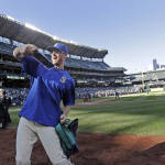 Seattle Mariners pitcher Charlie Furbush tosses memorabilia to fans after the team's final baseball game of the season Sunday, Oct. 4, 2015, in Seattle. The Mariners won 3-2. (AP Photo/Elaine Thompson)