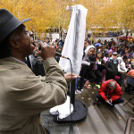 Carey Anderson, pastor of First African Methodist Episcopal Church in Seattle, speaks at a rally in downtown Seattle, Tuesday, Nov. 25, 2014, as protesters demonstrate against a grand jury's decision not to indict police officer Darren Wilson in the killing of Michael Brown. The peaceful march was a mix of students who walked out of schools and a coalition of clergy members. (AP Photo/Ted S. Warren)