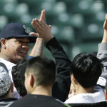 Seattle Mariners starting pitcher Felix Hernandez, left, is greeted Thursday, April 10, 2014 after he made a surprise appearance to group of Seattle-area students filming an anti-bullying video at Safeco Field in Seattle. (AP Photo/Ted S. Warren)