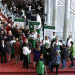 Shareholders and other guests arrive for the annual Starbucks Coffee Company shareholders meeting, Wednesday, March 19, 2014, in Seattle. (AP Photo/Ted S. Warren)