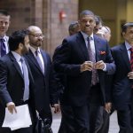Sacramento, Calif., Mayor Kevin Johnson, right front, a former NBA basketball player, walks out of an NBA Board of Governors meeting during a break Wednesday, May 15, 2013, in Dallas. (AP Photo/Tony Gutierrez)