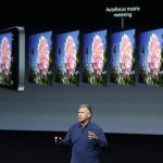 Phil Schiller, Apple's senior vice president of worldwide product marketing, speaks on stage about the camera quality during the introduction of the new iPhone 5s in Cupertino, Calif., Tuesday, Sept. 10, 2013. (AP Photo/Marcio Jose Sanchez)