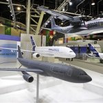Scale models of Airbus planes are displayed at the firm's booth during the first day of the Paris Air Show at Le Bourget airport, north of Paris, Monday June 17, 2013.(AP Photo/Remy de la Mauviniere)