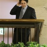 Sacramento Kings part owner George Maloof talks to a reporter from an overhead floor at a hotel during the NBA Board of Governors meeting Wednesday, May 15, 2013, in Dallas. (AP Photo/Tony Gutierrez)