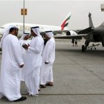 Emirati visitors talk in front of an Emirates Airbus A380 on display during the opening day of the Dubai Airshow in Dubai, United Arab Emirates, Sunday Nov. 17, 2013. The Dubai Airshow is seen as an increasingly important barometer on the state of the industry and the rising roles of the big-spending Gulf carriers Etihad, Qatar Airways and Emirates as they compete for routes and critical stopover traffic between Asia and Europe and the Americas. (AP Photo/Kamran Jebreili)