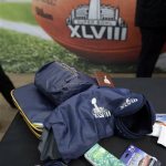 Cold weather gear, which will be given to people attending Super Bowl Super Bowl XLVII, are on display during a news conference at MetLife Stadium, Wednesday, Jan. 22, 2014, in East Rutherford, N.J. Super Bowl XLVIII, which will be played between the Denver Broncos and the Seattle Seahawks on Feb. 2, will be the first NFL title game held outdoors in a city where it snows. (AP Photo/Julio Cortez)