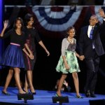 President Barack Obama waves as he walks on stage with first lady Michelle Obama and daughters Malia and Sasha at his election night party Wednesday, Nov. 7, 2012, in Chicago. President Obama defeated Republican challenger former Massachusetts Gov. Mitt Romney. (AP Photo/Chris Carlson)